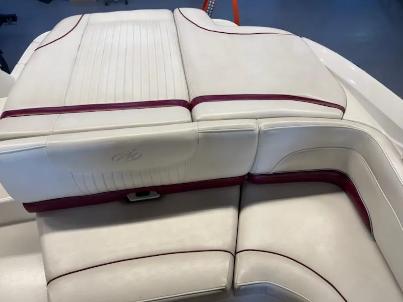 Slide: The Image of 2006 Monterey 234FS boat interior with white and maroon upholstery. - 21