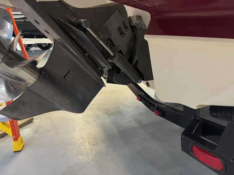 Slide: The Image of 2006 Monterey 234FS boat outdrive and propeller in a garage setting. - 29