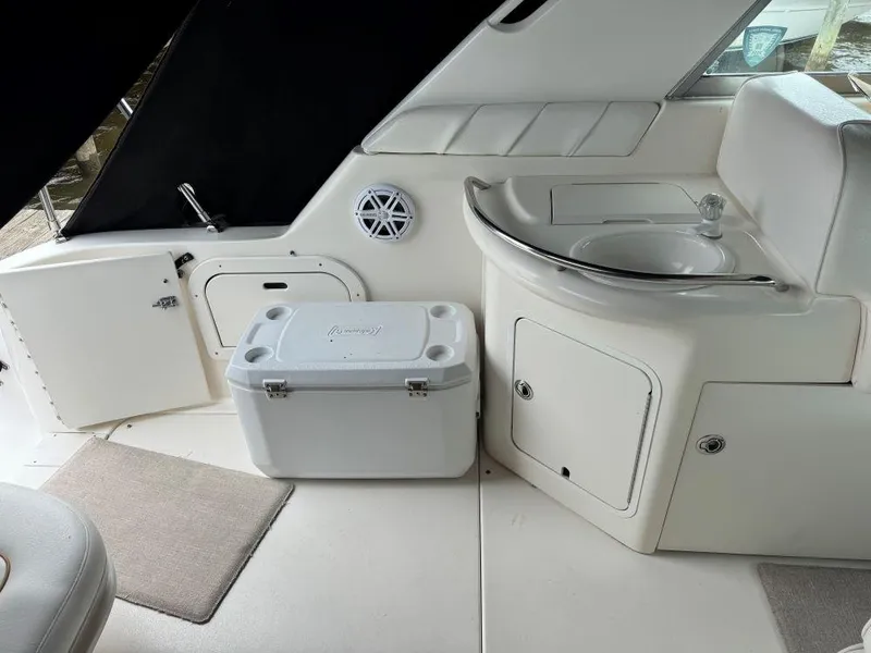 Slide: The Image of Interior of 1999 Sea Ray 330 Sundancer with sink and cooler. - 16