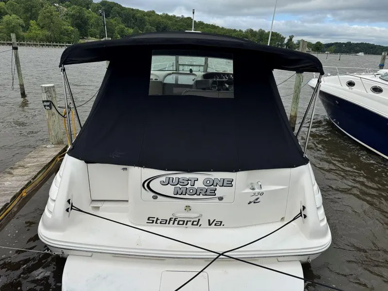 Slide: The Image of 1999 Sea Ray 330 Sundancer docked, rear view with black canopy, Stafford, Va. - 17