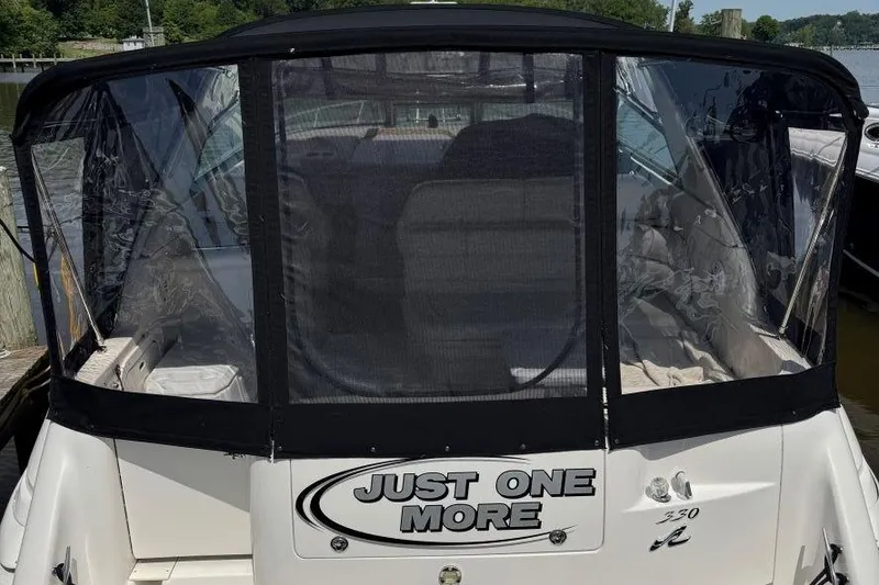 Slide: The Image of 1999 Sea Ray 330 Sundancer boat with "Just One More" text on the back. - 19