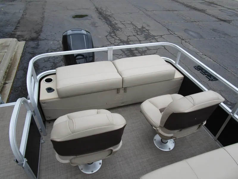 Slide: The Image of 2019 Sun Tracker SPORT FISH 22 XP3 boat interior with beige seating and motor. - 10