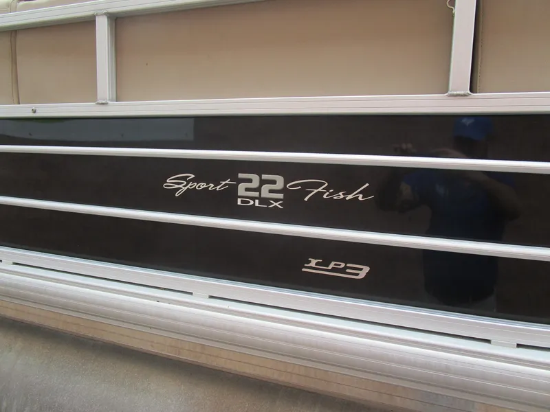 Slide: The Image of 2019 Sun Tracker SPORT FISH 22 XP3 boat side panel with model branding. - 13