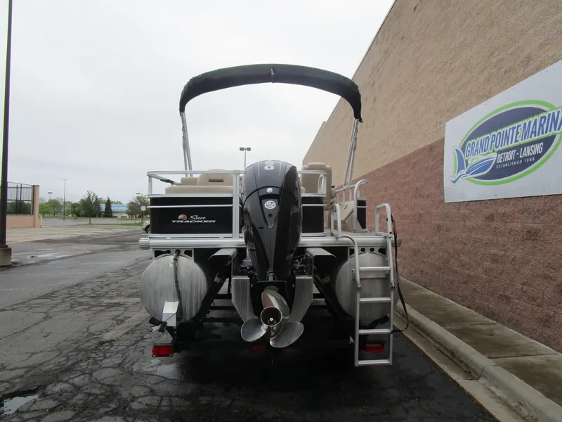 Slide: The Image of 2019 Sun Tracker SPORT FISH 22 XP3 pontoon boat, rear view with motor and ladder. - 15