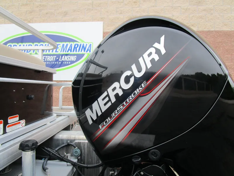 Slide: The Image of Mercury FourStroke engine on 2019 Sun Tracker SPORT FISH 22 XP3 boat at marina. - 2
