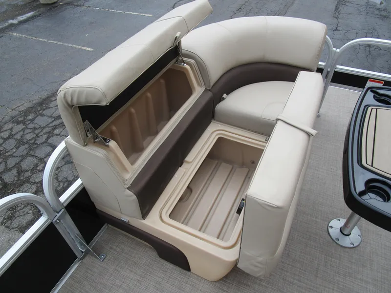 Slide: The Image of 2019 Sun Tracker SPORT FISH 22 XP3 boat seating with storage compartments open. - 6