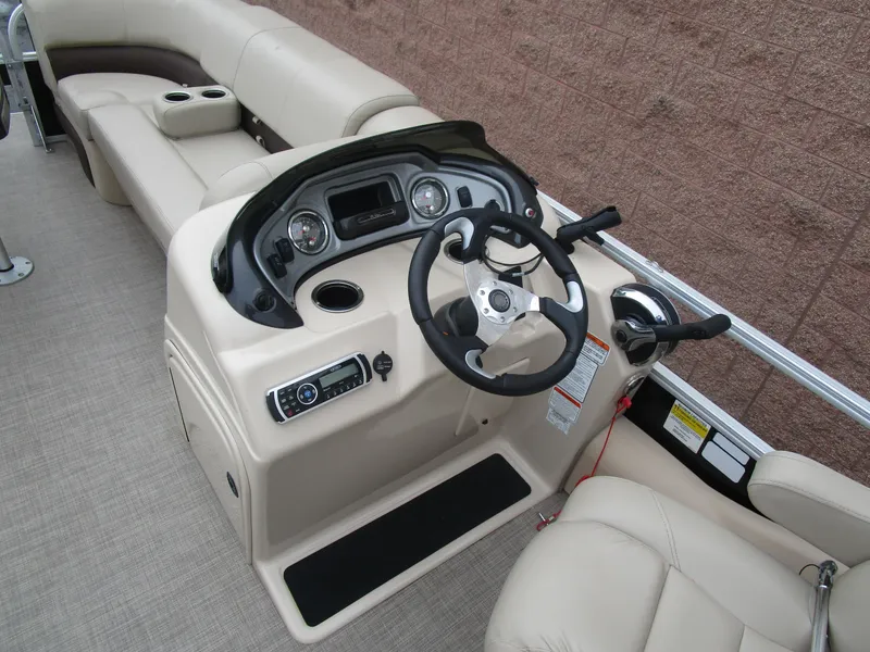 Slide: The Image of 2019 Sun Tracker SPORT FISH 22 XP3 boat interior with steering console and seating. - 8