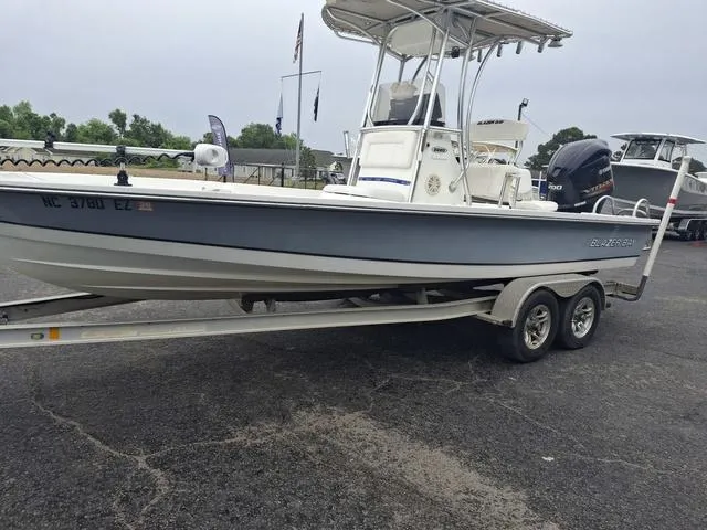 Slide: The Image of 2013 Blazer 2220 Fisherman boat on trailer, parked outdoors. - 11
