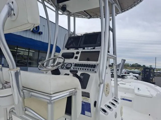 Slide: The Image of 2013 Blazer 2220 Fisherman boat dashboard with steering wheel and navigation equipment. - 3