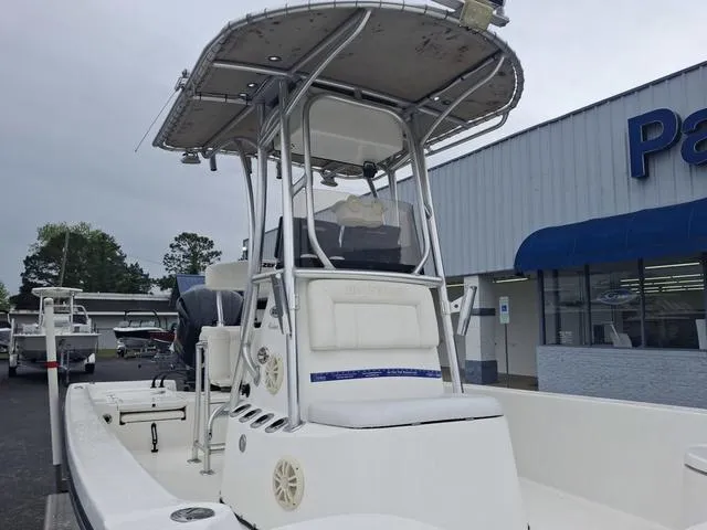 Slide: The Image of 2013 Blazer 2220 Fisherman boat with T-top, parked outside a dealership. - 5