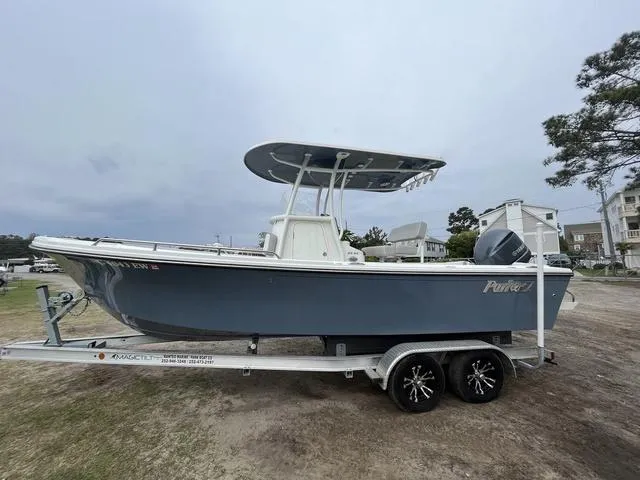 Slide: The Image of 2022 Parker 2300 SE boat on trailer, side view, overcast sky. - 3
