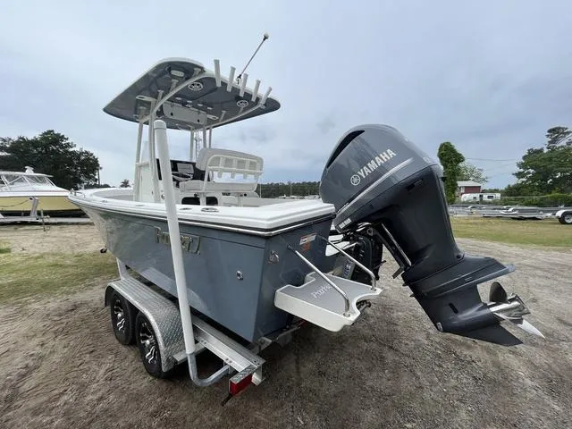 Slide: The Image of 2022 Parker 2300 SE boat with Yamaha outboard motor on a trailer. - 4