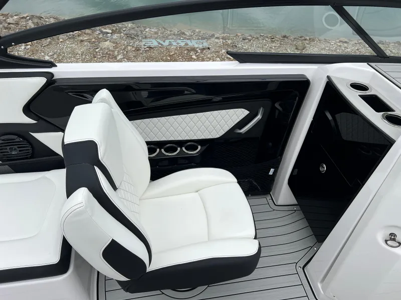 Slide: The Image of Luxurious interior of 2025 Yamaha Boats 252SD, featuring sleek white seating and modern design. - 11