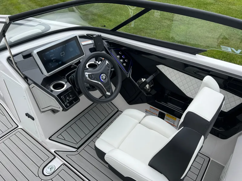 Slide: The Image of 2025 Yamaha Boats 252SD cockpit with modern dashboard and steering wheel design. - 12