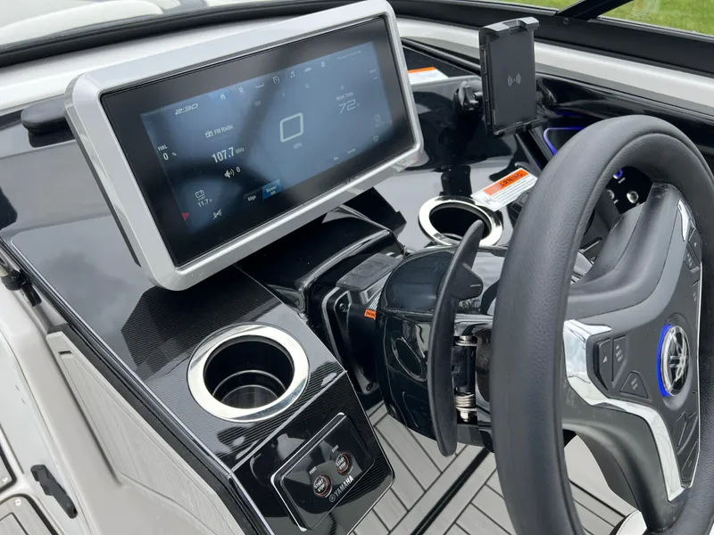 Slide: The Image of 2025 Yamaha Boats 252SD dashboard with touchscreen display and steering wheel. - 13