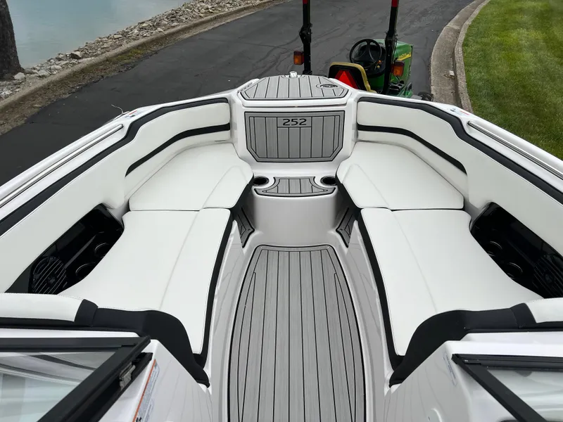 Slide: The Image of 2025 Yamaha Boats 252SD interior with sleek white seating and modern design. - 17