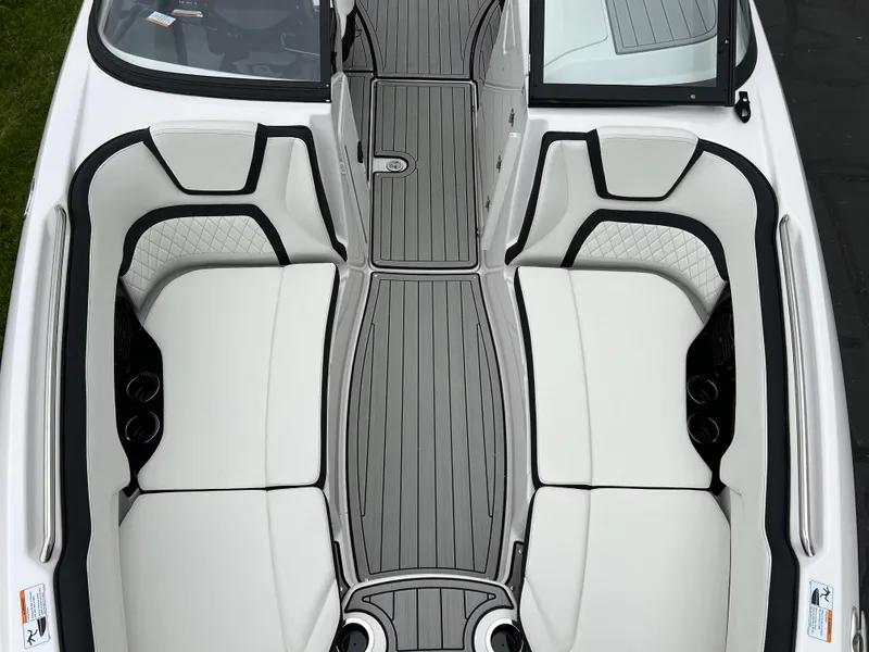 Slide: The Image of 2025 Yamaha Boats 252SD interior with sleek white seating and modern design. - 18