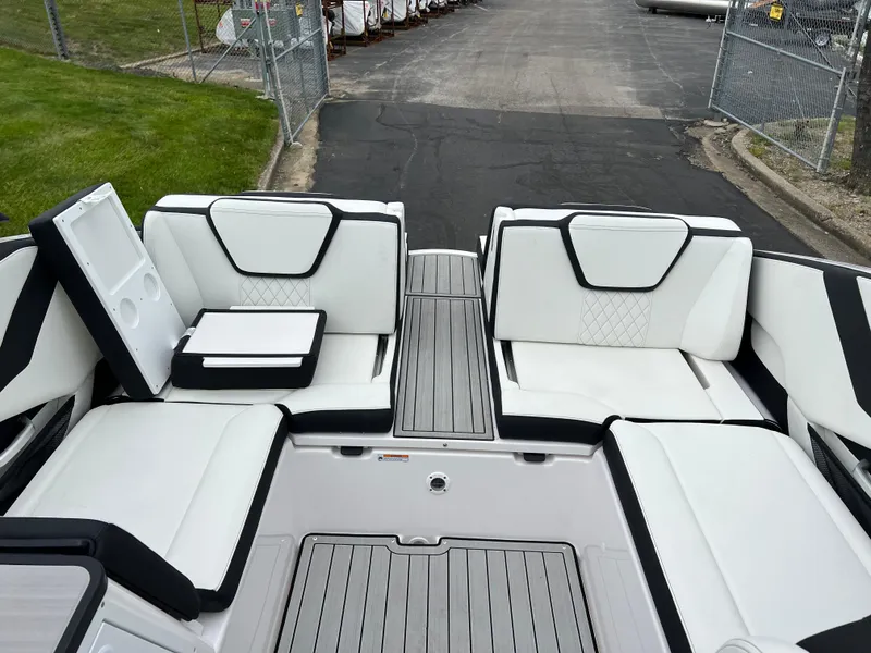 Slide: The Image of 2025 Yamaha Boats 252SD interior with sleek white seating and modern design. - 21