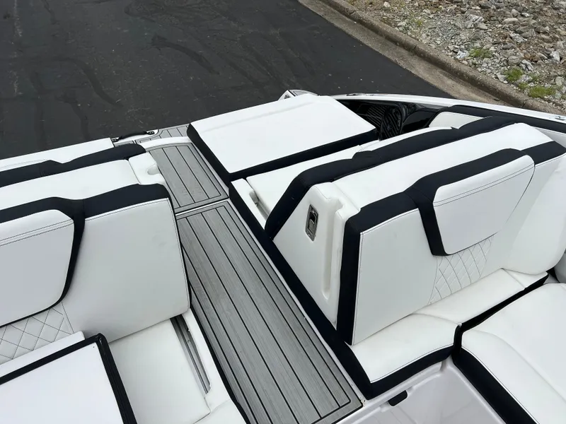 Slide: The Image of 2025 Yamaha Boats 252SD interior with white and black seating, sleek design. - 23