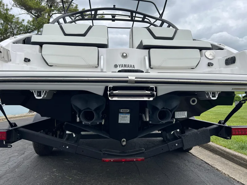 Slide: The Image of 2025 Yamaha Boats 252SD rear view, showcasing dual engines and sleek design. - 7