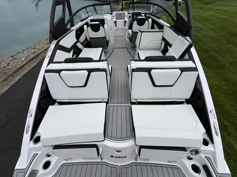 Slide: The Image of 2025 Yamaha Boats 252SD interior with sleek white seating and modern design. - 8