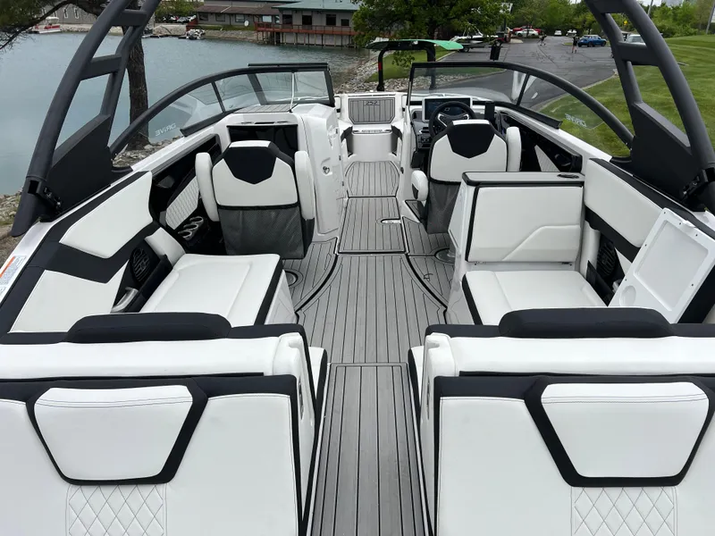 Slide: The Image of 2025 Yamaha Boats 252SD interior with sleek white seating and modern design. - 9