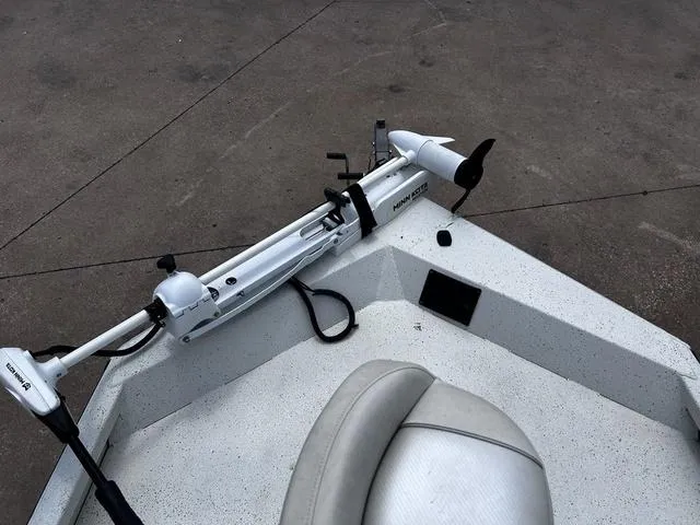 Slide: The Image of 2017 Ranger RB190 boat with trolling motor on deck, featuring a white and gray seat. - 10