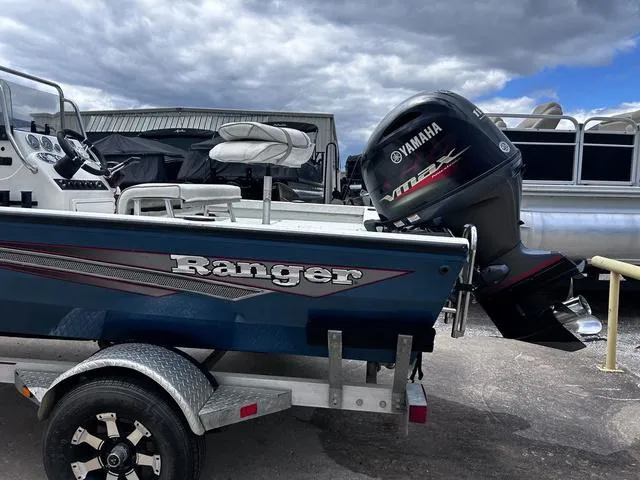 Slide: The Image of 2017 Ranger RB190 boat with Yamaha outboard motor on a trailer, parked outdoors. - 3