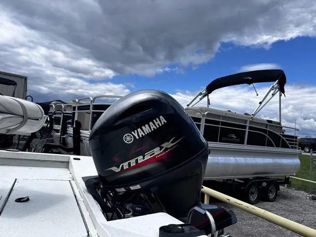 Slide: The Image of Yamaha VMAX engine on a 2017 Ranger RB190 boat, with pontoon boats in the background. - 5