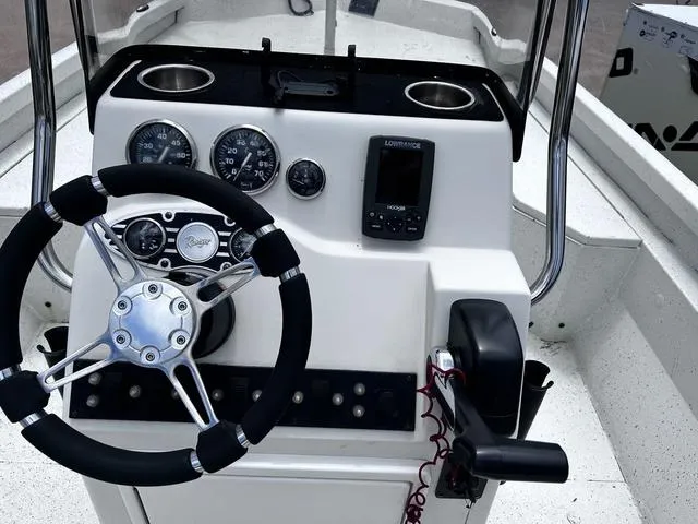 Slide: The Image of 2017 Ranger RB190 boat dashboard with steering wheel, gauges, and navigation system. - 9