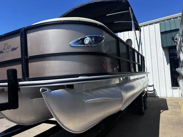 Slide: The Image of 2019 Bentley Pontoons 223 Bentley Elite Admiral pontoon boat with canopy, parked outdoors. - 10