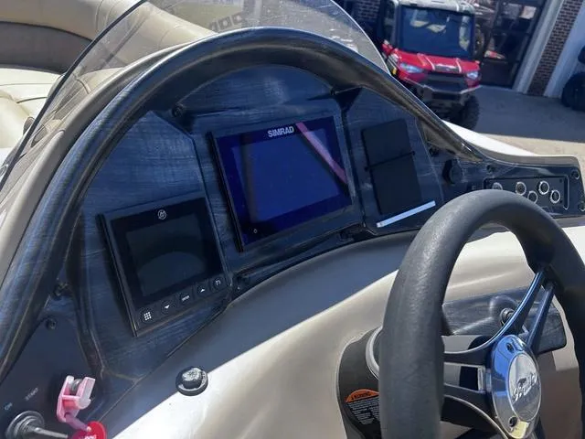 Slide: The Image of 2019 Bentley Pontoons 223 Bentley Elite Admiral dashboard with navigation system and steering wheel. - 21