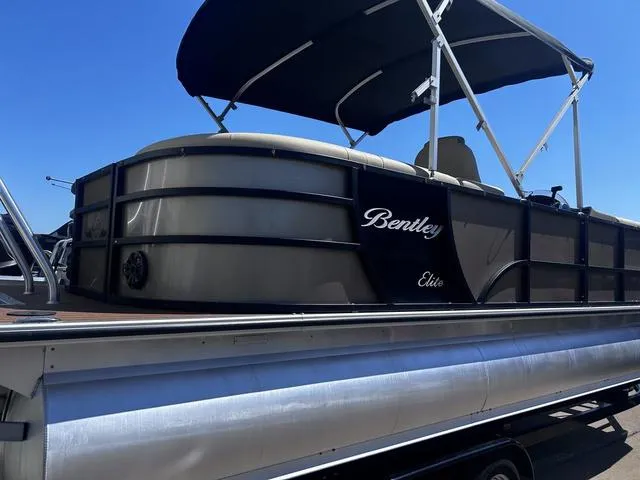 Slide: The Image of 2019 Bentley Pontoons 223 Bentley Elite Admiral with canopy, side view on trailer. - 4