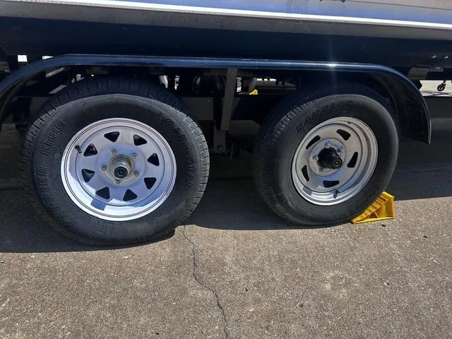 Slide: The Image of Trailer wheels of a 2019 Bentley Pontoons 223 Bentley Elite Admiral on pavement. - 8