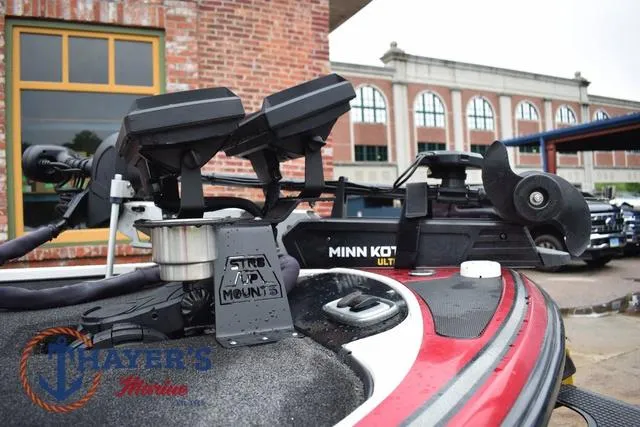 Slide: The Image of 2015 Nitro Z Series Z-8 boat with Minn Kota trolling motor and electronics, parked near a brick building. - 10