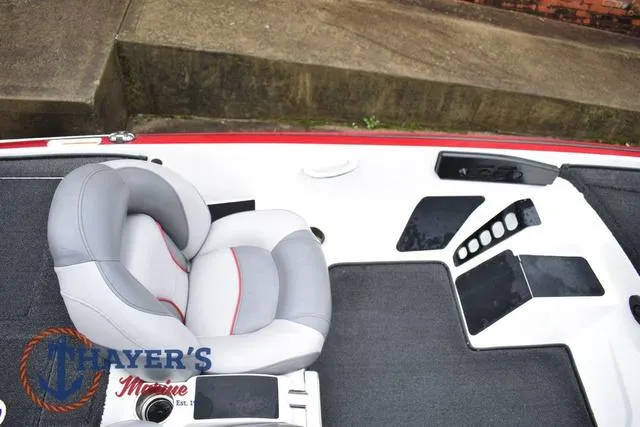 Slide: The Image of 2015 Nitro Z Series Z-8 boat interior with gray and red seating, dashboard controls. - 18