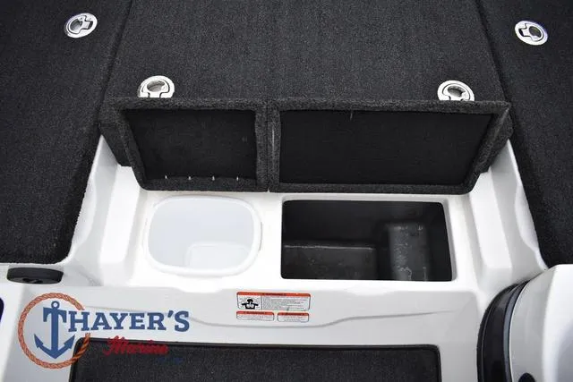 Slide: The Image of 2015 Nitro Z Series Z-8 boat deck with storage compartments and Thayer's Marine logo. - 23