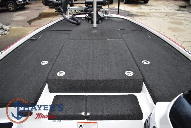 Slide: The Image of 2015 Nitro Z Series Z-8 boat deck with carpeted surface and storage compartments. - 24