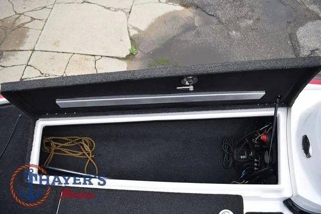 Slide: The Image of Open storage compartment in a 2015 Nitro Z Series Z-8 boat, showing ropes and equipment. - 27