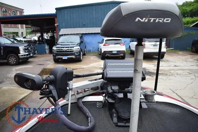 Slide: The Image of 2015 Nitro Z Series Z-8 boat with fishing equipment and motor, parked in a lot. - 28