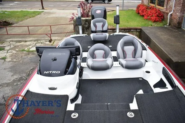Slide: The Image of 2015 Nitro Z Series Z-8 boat with seating and motor, displayed outdoors. - 31