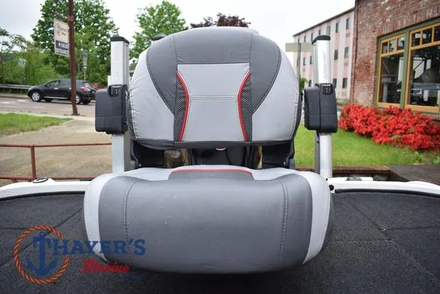 Slide: The Image of 2015 Nitro Z Series Z-8 boat seat with gray and red accents, outdoor setting. - 33