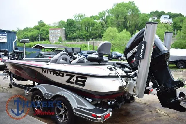 Slide: The Image of 2015 Nitro Z Series Z-8 boat with Mercury engine on trailer, parked outdoors. - 4