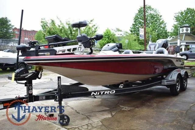 Slide: The Image of 2015 Nitro Z Series Z-8 boat on trailer, displayed outdoors at Thayer's Marine. - 5