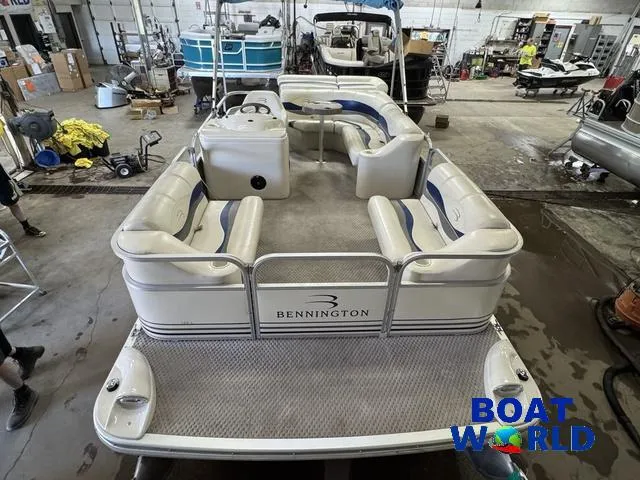 Slide: The Image of 2005 Bennington 186L Pontoon boat in a workshop setting, featuring spacious seating. - 10