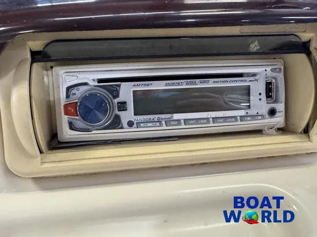 Slide: The Image of 2005 Bennington 186L Pontoon stereo system with Pandora Bluetooth, Boat World logo visible. - 20