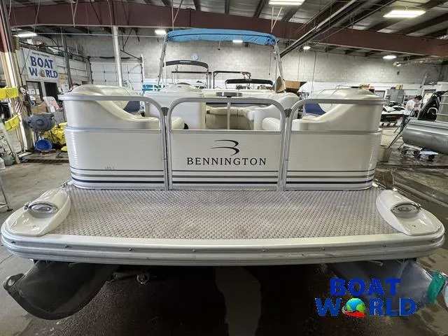 Slide: The Image of 2005 Bennington 186L Pontoon boat in a showroom, rear view. - 31