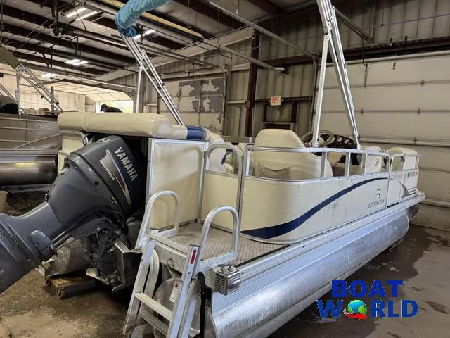 Slide: The Image of 2005 Bennington 186L Pontoon boat with Yamaha motor in a garage setting. - 39