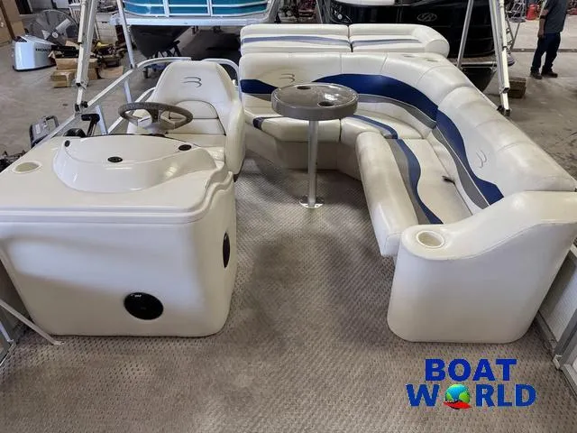 Slide: The Image of 2005 Bennington 186L Pontoon interior with seating and steering console at Boat World showroom. - 5
