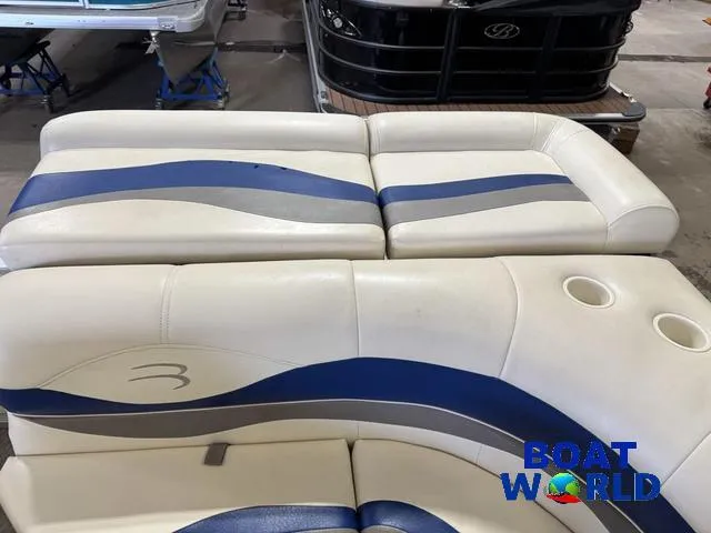 Slide: The Image of 2005 Bennington 186L Pontoon boat seats with blue and gray accents at Boat World showroom. - 8